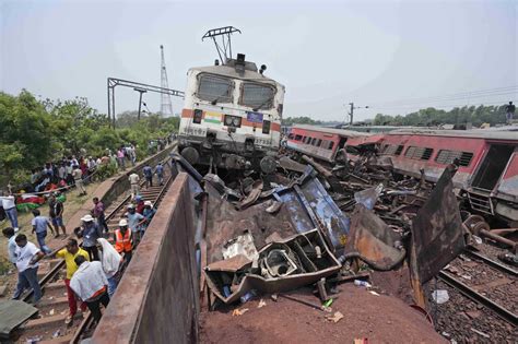 Indian authorities arrest 3 railway officials over the train crash that killed more than 290 people